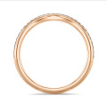 0.23 Karat geschwungener Memoire Ring mit Diamanten (halb besetzt) aus Rotgold