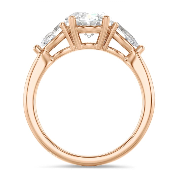 Trilogie-Ring mit einem ovalen Diamanten von 3.00 Karat und seitlichen tropfenförmigen Diamanten von je 0.35 Karat in Rotgold