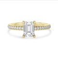 3.00 Karat Solitärring mit Diamant im Smaragdschliff und hidden halo aus Gelbgold