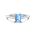 1.00 carat solitaire ring with a blue lab grown emerald cut diamond in white gold