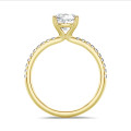 2.50 carat solitaire ring with a lab grown cushion diamond in yellow gold with lab grown side diamonds