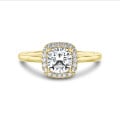 1.20 carat solitaire halo ring with a cushion diamond in yellow gold with round diamonds