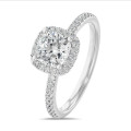 1.50 carat solitaire halo ring with a lab grown cushion diamond in white gold with round lab grown diamonds
