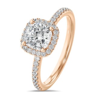2.50 carat solitaire halo ring with a cushion diamond in red gold with round diamonds