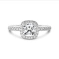 1.00 carat solitaire halo ring with a cushion diamond in white gold with round diamonds