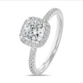 2.00 carat solitaire halo ring with a lab grown cushion diamond in white gold with round lab grown diamonds