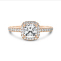 1.00 carat solitaire halo ring with a lab grown cushion diamond in red gold with round lab grown diamonds