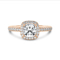 3.00 carat solitaire halo ring with a cushion diamond in red gold with round diamonds