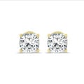 4.00 carat solitaire cushion cut diamond earrings in yellow gold
