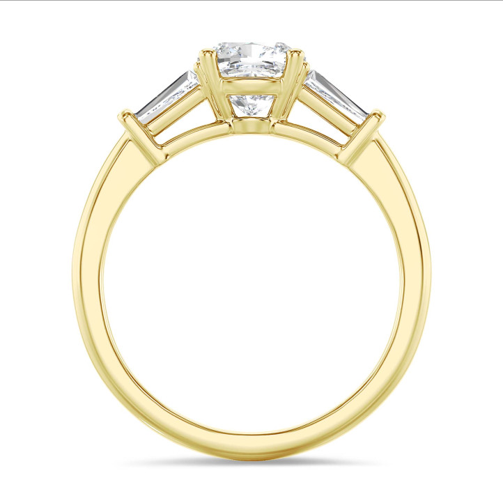 1.00 carat trilogy ring in yellow gold with a lab grown cushion diamond and lab grown tapered baguettes
