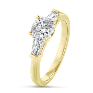 1.00 carat trilogy ring in yellow gold with a lab grown cushion diamond and lab grown tapered baguettes