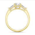 1.00 carat trilogy ring in yellow gold with a lab grown cushion diamond and lab grown tapered baguettes