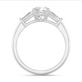 1.00 carat trilogy ring in platinum with a lab grown cushion diamond and lab grown tapered baguettes