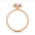 1.20 carat solitaire halo ring with a pink lab grown cushion diamond in red gold with round lab grown diamonds