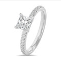 1.50 carat solitaire ring with a princess diamond in white gold with side diamonds