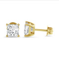 4.00 carat solitaire earrings in yellow gold with lab grown princess diamonds