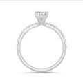 1.00 carat solitaire ring with pear diamond in white gold with side diamonds