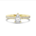 1.20 carat solitaire ring with pear diamond in yellow gold with side diamonds