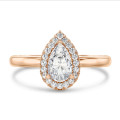 2.00 carat solitaire halo ring with pear diamond in red gold with round diamonds