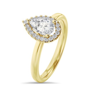 1.00 carat solitaire halo ring with lab grown pear diamond in yellow gold with round lab grown diamonds