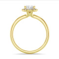 1.20 carat solitaire halo ring with pear diamond in yellow gold with round diamonds