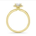 3.00 carat solitaire halo ring with pear diamond in yellow gold with round diamonds