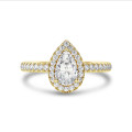 2.50 carat solitaire halo ring with lab grown pear diamond in yellow gold with round lab grown diamonds