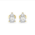 2.00 carat solitaire pear cut diamond earrings in yellow gold