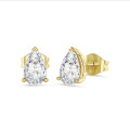 4.00 carat solitaire pear cut diamond earrings in yellow gold