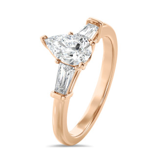 1.00 carat trilogy ring in red gold with lab grown pear diamond and lab grown tapered baguettes
