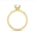 3.00 carat solitaire ring with a emerald cut diamond in yellow gold