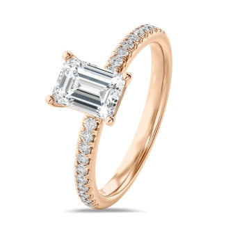 1.00 carat solitaire ring with a emerald cut diamond in red gold with side diamonds