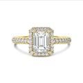 1.00 carat solitaire halo ring with a emerald cut diamond in yellow gold with round diamonds