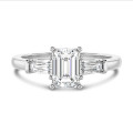 1.00 carat trilogy ring in white gold with a lab grown emerald cut diamond and lab gown tapered baguettes
