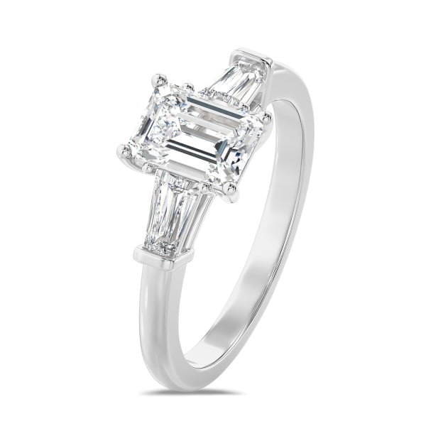 1.00 carat trilogy ring in platinum with a lab grown emerald cut diamond and lab gown tapered baguettes