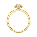 1.00 carat solitaire halo ring with oval diamond in yellow gold with round diamonds