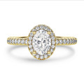1.00 carat solitaire halo ring with lab grown oval diamond in yellow gold with round lab grown diamonds