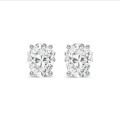 2.00 carat solitaire oval cut diamond earrings in white gold
