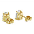 2.00 carat solitaire oval cut diamond earrings in yellow gold