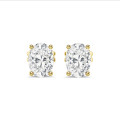 3.00 carat solitaire oval cut diamond earrings in yellow gold