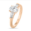 1.00 carat trilogy ring in red gold with lab grown oval diamond and lab grown tapered baguettes