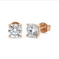 2.00 carat solitaire earrings with round diamonds in red gold