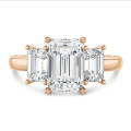 4.40 carat trilogy ring in red gold with lab grown emerald cut diamonds