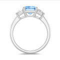 4.40 carat trilogy ring in white gold with a blue emerald cut diamond and white emerald cut diamonds