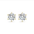 2.00 carat solitaire diamond earrings in yellow gold