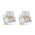 6.00 carat lab grown diamond trilogy earrings in yellow gold