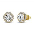 2.00 carat diamond halo earrings in yellow gold