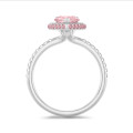 1.00 carat solitaire white halo ring with pink side halo and pink lab grown pear diamond and lab grown side diamonds in white gold