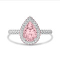 1.00 carat solitaire white halo ring with pink side halo and pink lab grown pear diamond and lab grown side diamonds in white gold