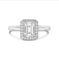 5.00 carat solitaire halo ring with a emerald cut diamond in white gold with round diamonds